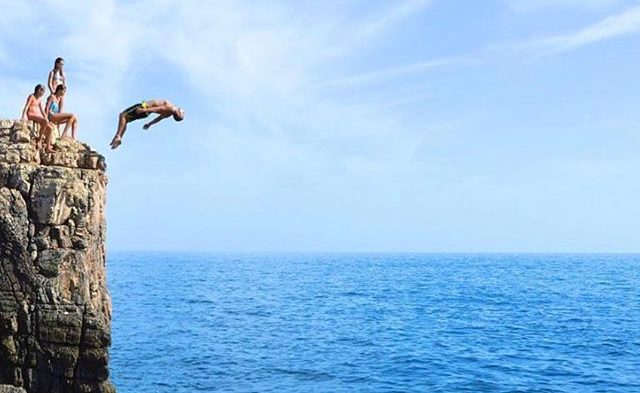 guy jumping of cliff